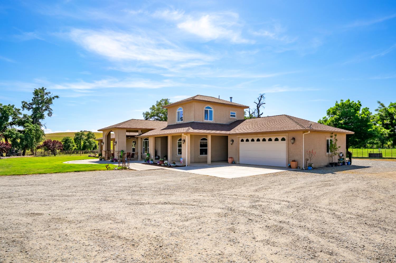 15605 Johnson Road Red Bluff, CA 96080 - Photo 52 of 88 a view of a house with a yard and potted plants