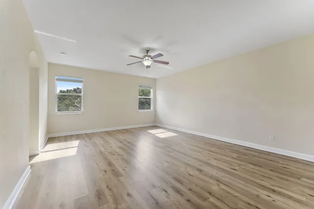 a bathroom with a tub shower and sink