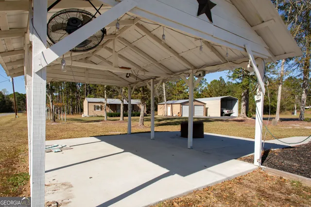 a view of a house with a yard and garage