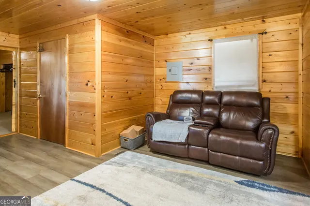 a view of living room with furniture and a flat screen tv