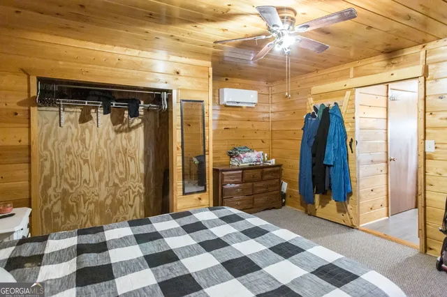 a view of water heater room with a washer dryer