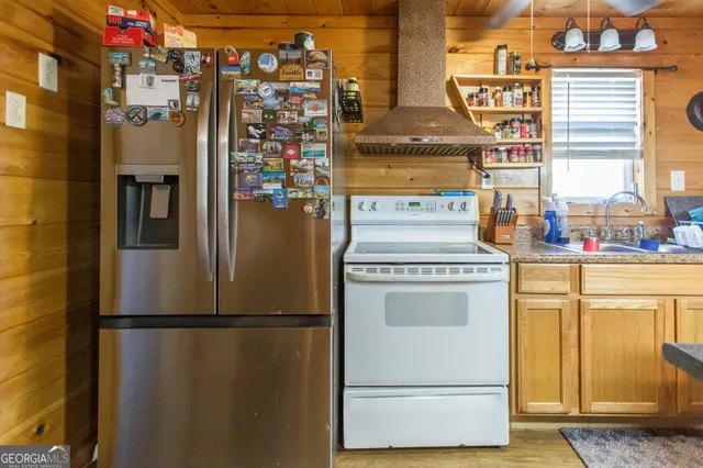 a view of a kitchen with wooden floor