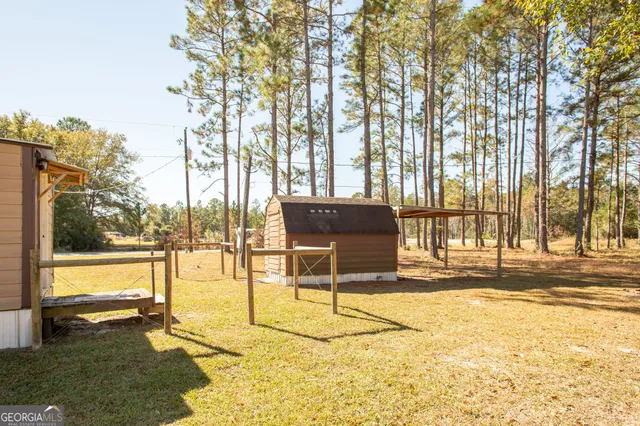 a view of a swimming pool with an outdoor space and seating area