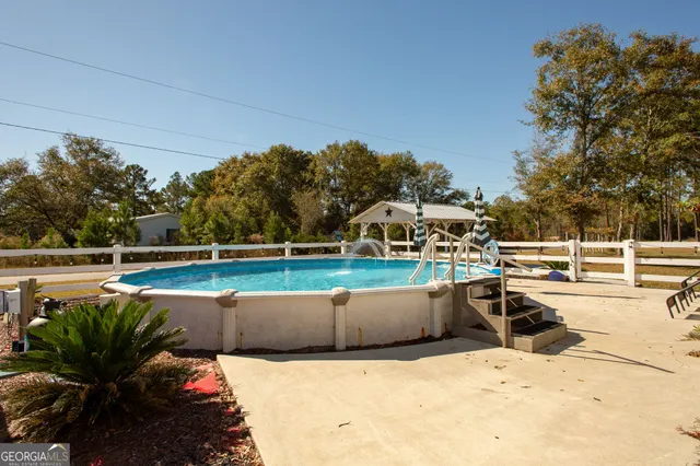 a view of a porch with a table and chairs