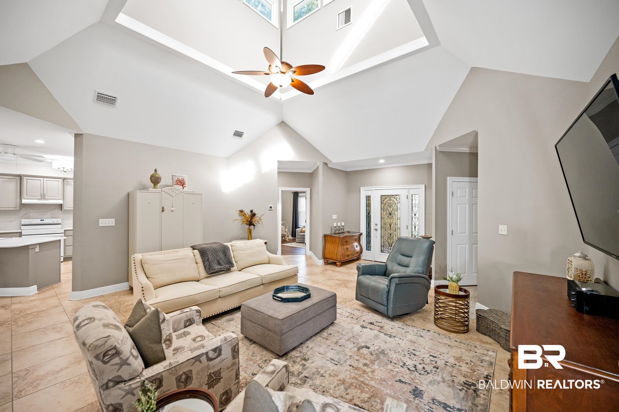 5217 Greentree Road Orange Beach, AL 36561 - Photo 36 of 58 Living room featuring a ceiling fan, high vaulted ceiling, recessed lighting, and light tile patterned floors