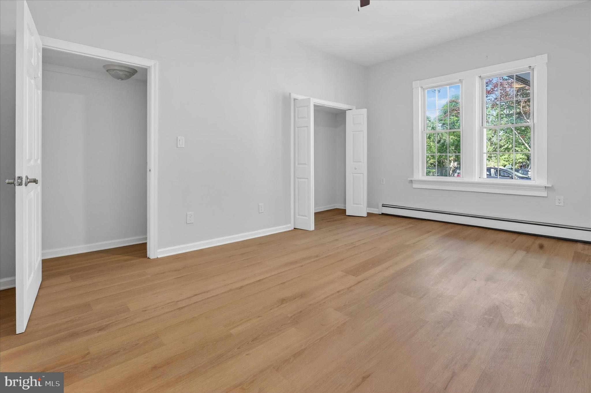 509 Lumberton Road, Unit 1 Hainesport, NJ 08036 - Photo 24 of 33 a view of an empty room with wooden floor and a window