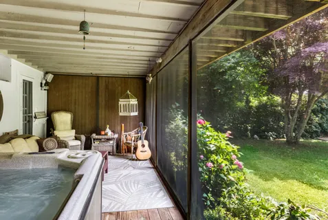 a living room filled with furniture and a patio
