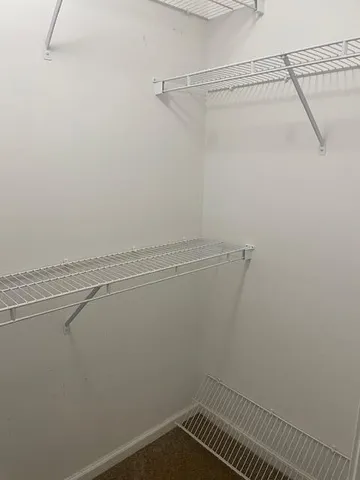 a bedroom with a bed and wall painting