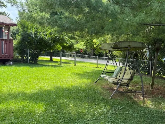 a view of swimming pool with a bench