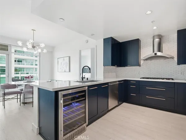 a kitchen with stainless steel appliances granite countertop a sink counter space and cabinets