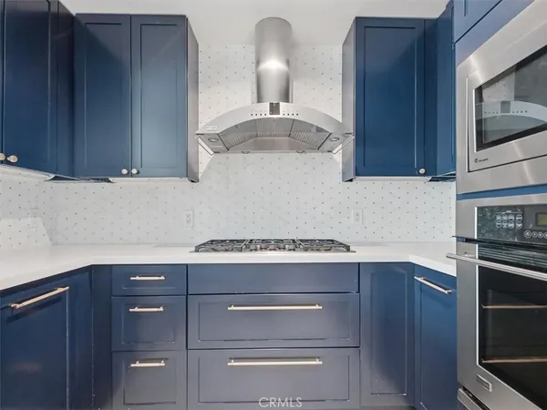 a kitchen with a stove and a microwave