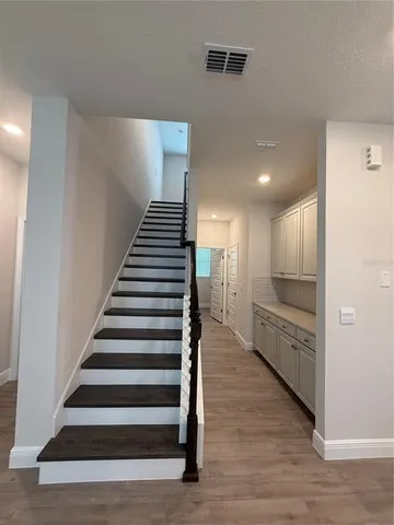 a view of entryway with wooden floor