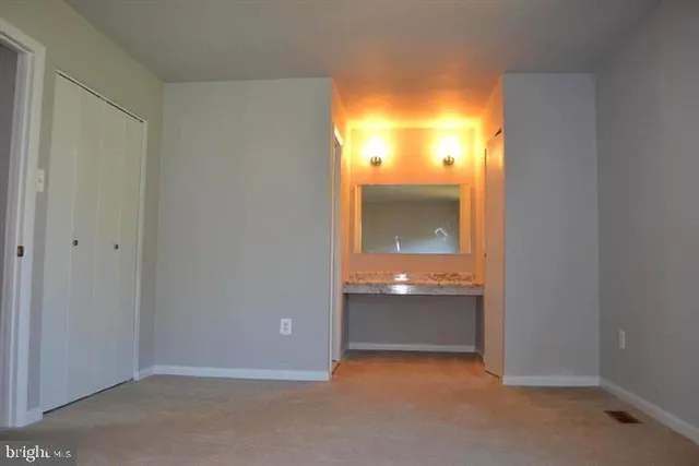 wooden floor and cabinet in an empty room