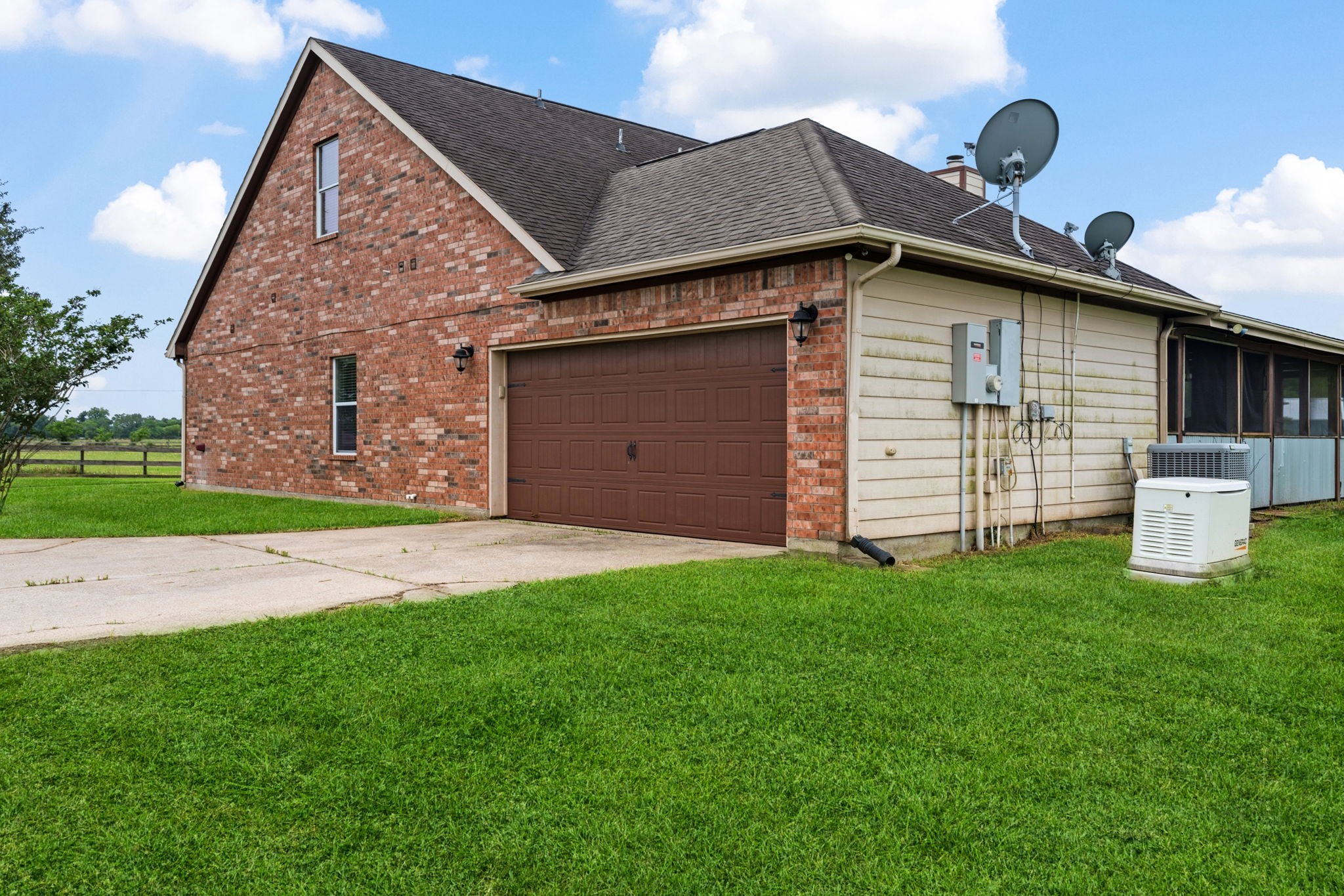 1405 Big Hill Road Winnie, TX 77665 - Photo 15 of 43 a front view of a house with a garden