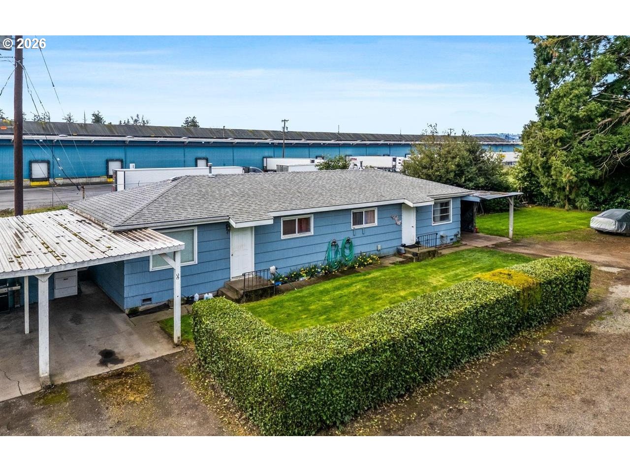 4125-4135 Portland Road Northeast Salem, OR 97301 - Photo 11 of 16 a view of a house with a yard balcony and sitting area
