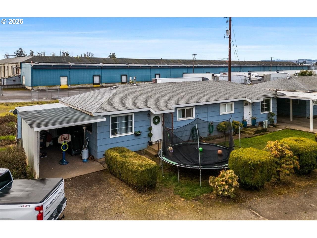 4125-4135 Portland Road Northeast Salem, OR 97301 - Photo 13 of 16 a view of a patio with table and chairs and potted plants