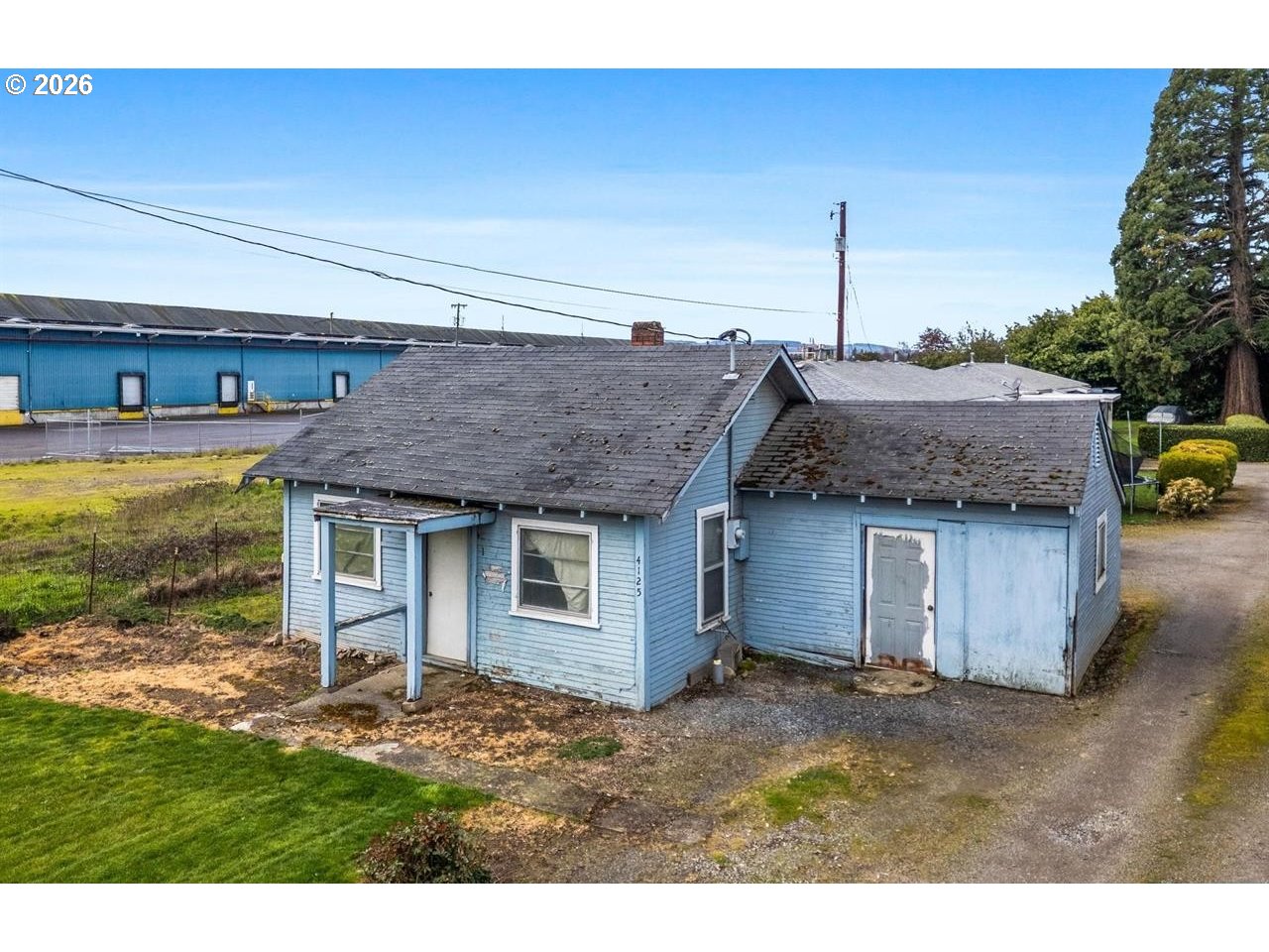 4125-4135 Portland Road Northeast Salem, OR 97301 - Photo 14 of 16 a view of a house with backyard and garden