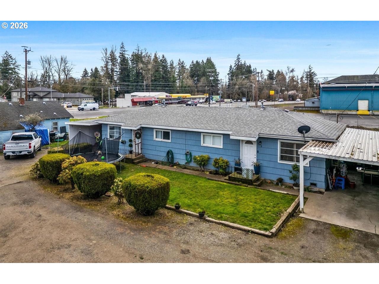 4125-4135 Portland Road Northeast Salem, OR 97301 - Photo 10 of 16 a aerial view of a house with swimming pool and a yard