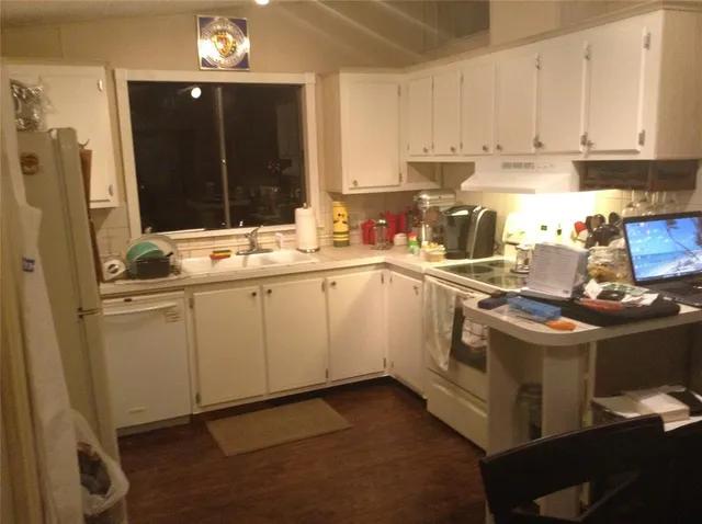 a kitchen with a sink and cabinets