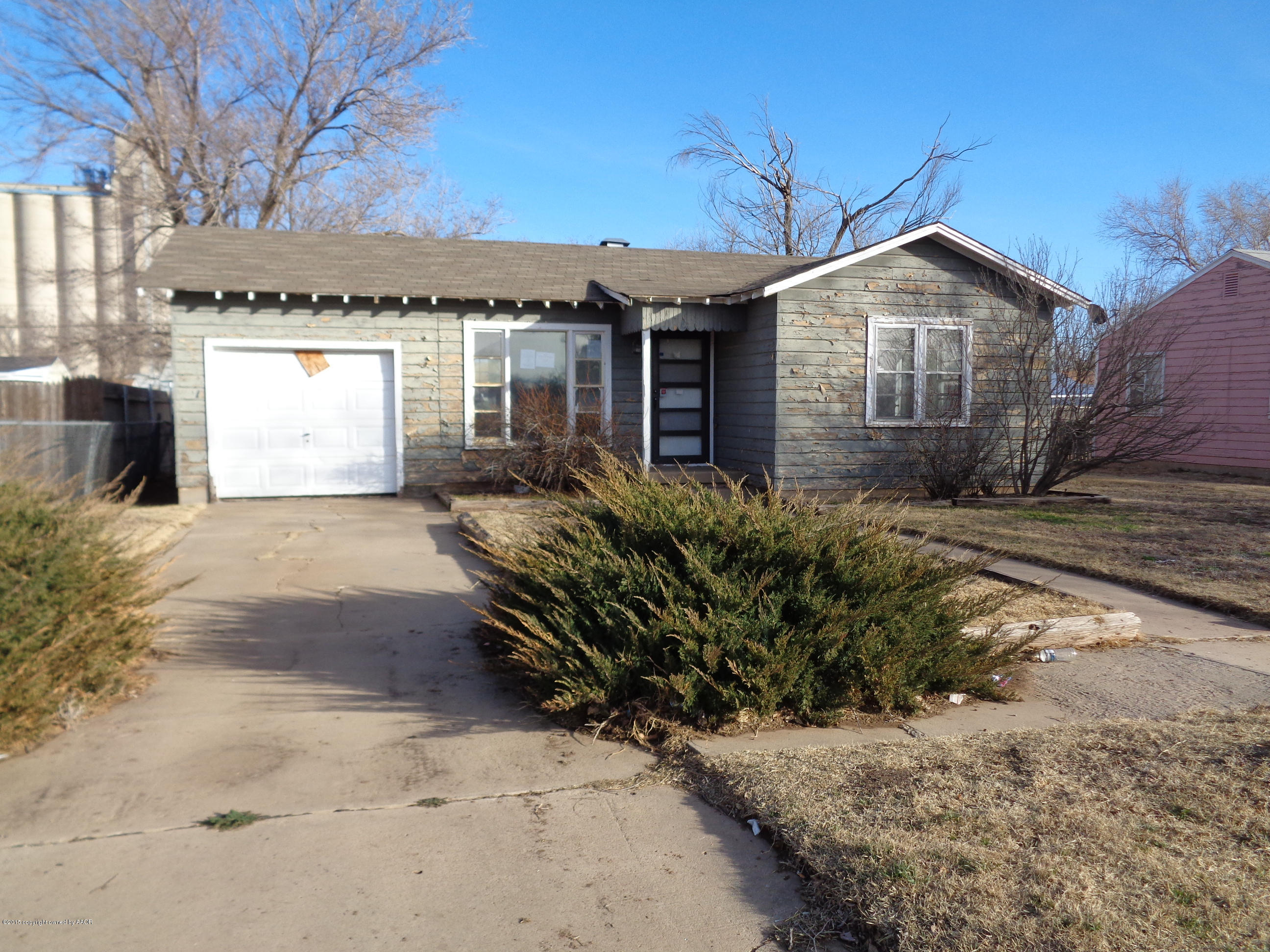 4345 South Tyler Street Amarillo, TX 79110 - Photo 1 of 10 a front view of house with yard and trees in the background