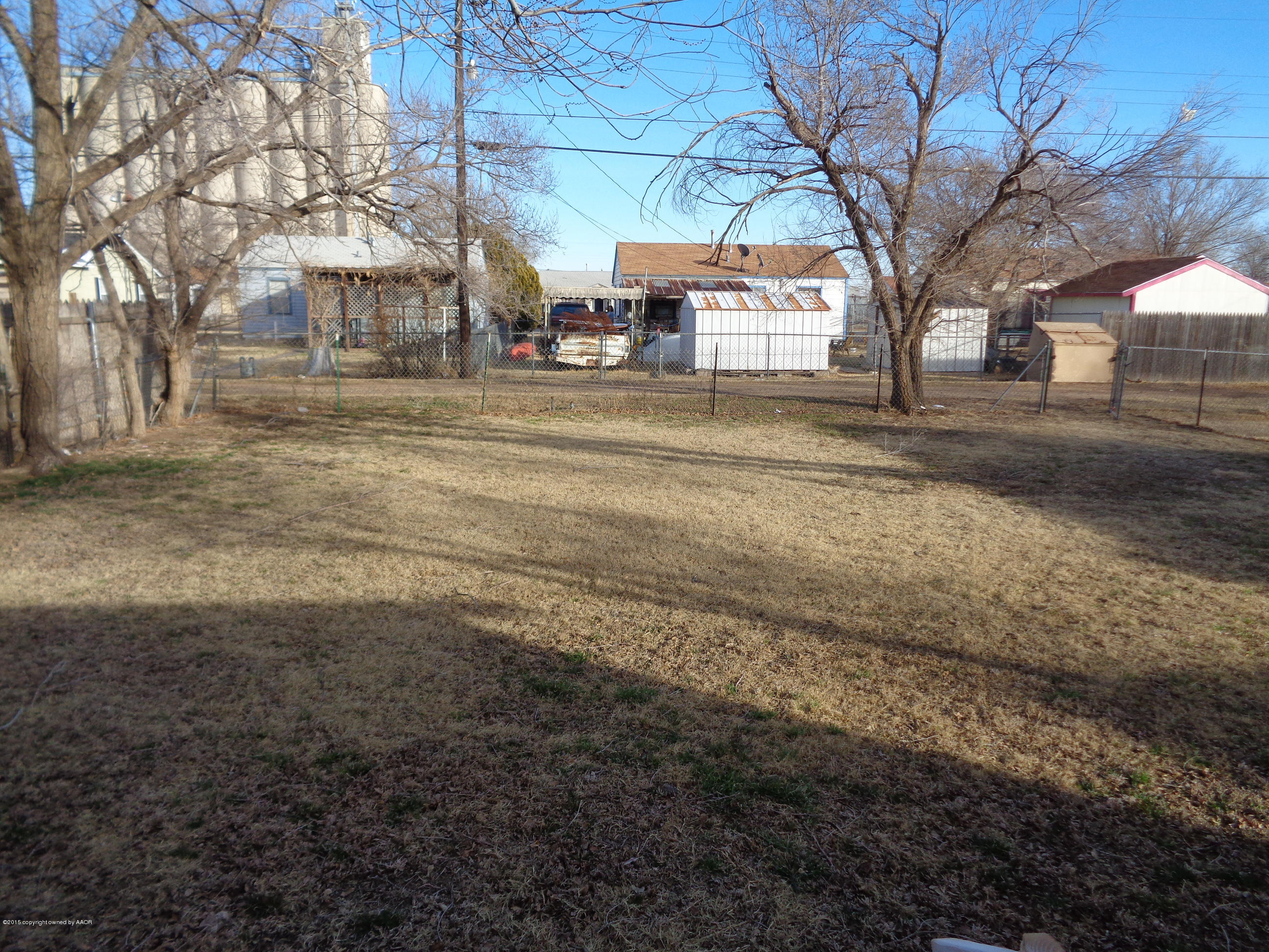 4345 South Tyler Street Amarillo, TX 79110 - Photo 10 of 10 a backyard of a house with large trees and outdoor seating