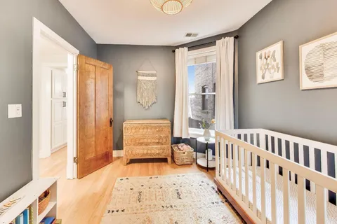 a bedroom with furniture and a window