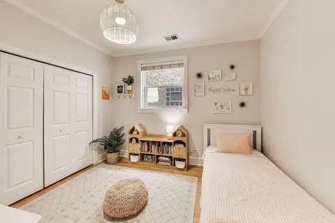 a bedroom with a bed and a cabinets