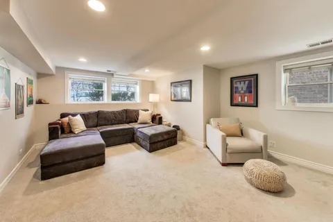 a view of living room with furniture and a flat screen tv