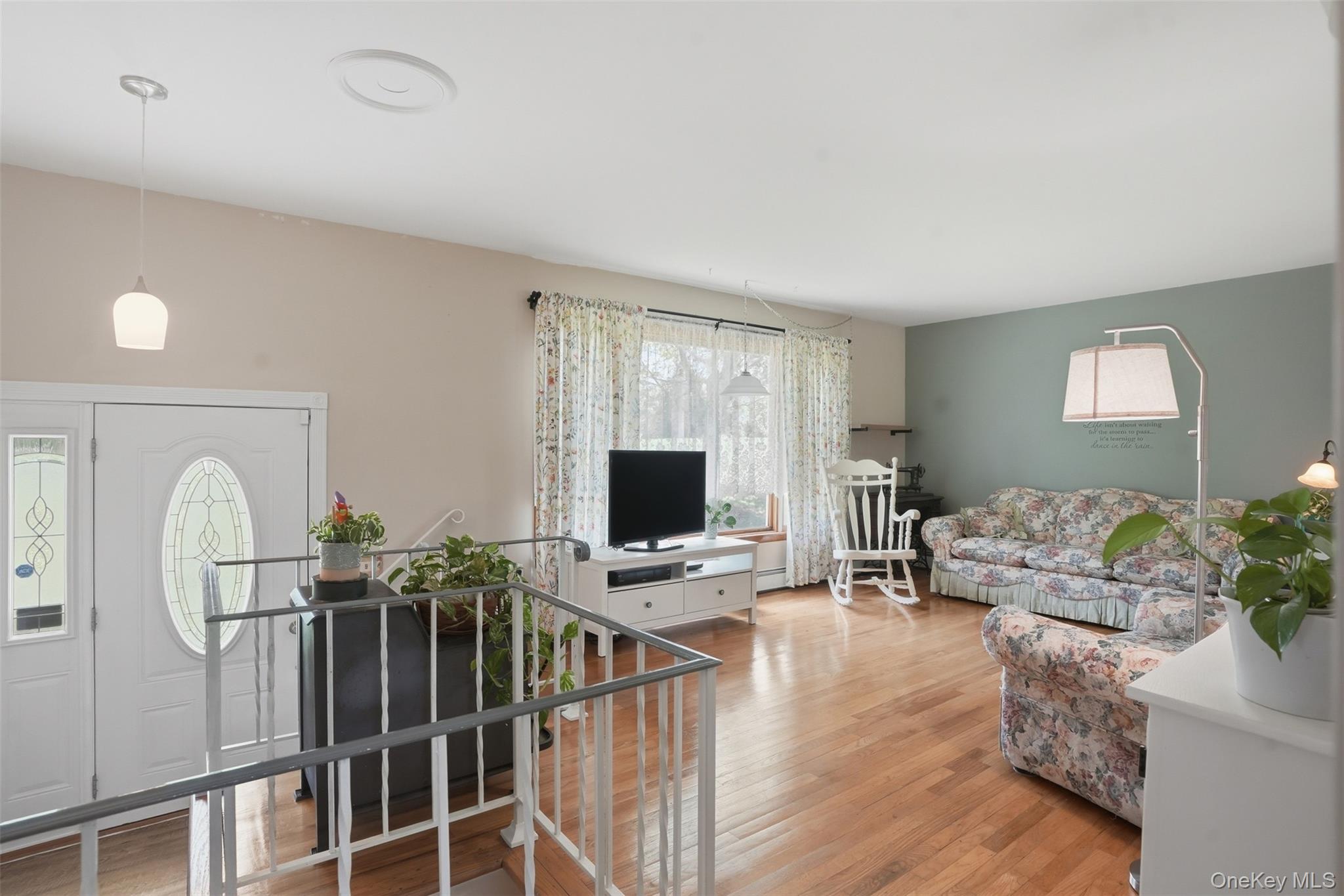 23 Old Cross Road Warwick, NY 10990 - Photo 6 of 34 Upon entering, a short stairway leads you to this bright and spacious living room with wood floors and large window