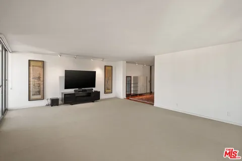 a view of a livingroom with a flat screen tv and a couch