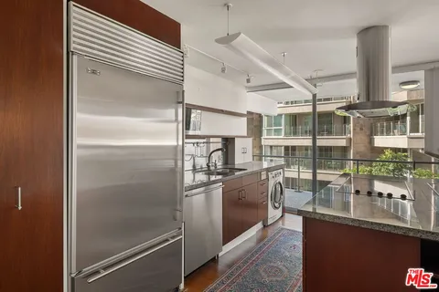 a kitchen with counter top space and stainless steel appliances