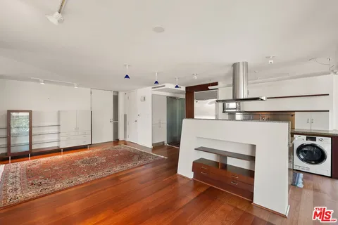 a bedroom with a bed and a television