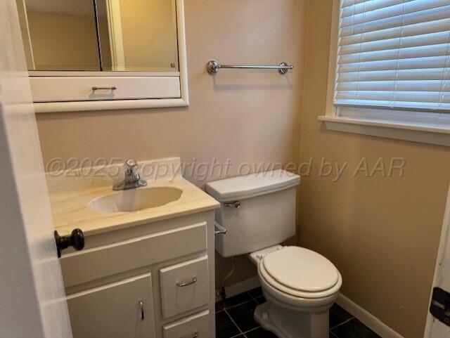 3313 Lenwood Drive Amarillo, TX 79109 - Photo 6 of 10 a bathroom with a sink and a toilet