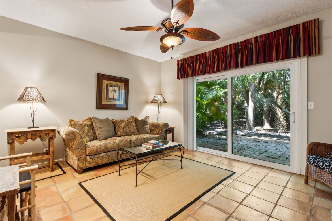3028 Sea Marsh Road, Unit 3028 Fernandina Beach, FL 32034 - Photo 12 of 39 a living room with furniture and a window