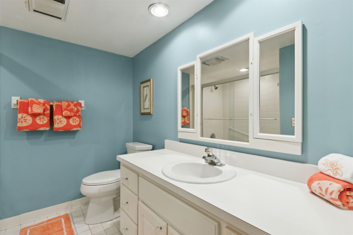 3028 Sea Marsh Road, Unit 3028 Fernandina Beach, FL 32034 - Photo 17 of 39 a bathroom with a sink and a toilet