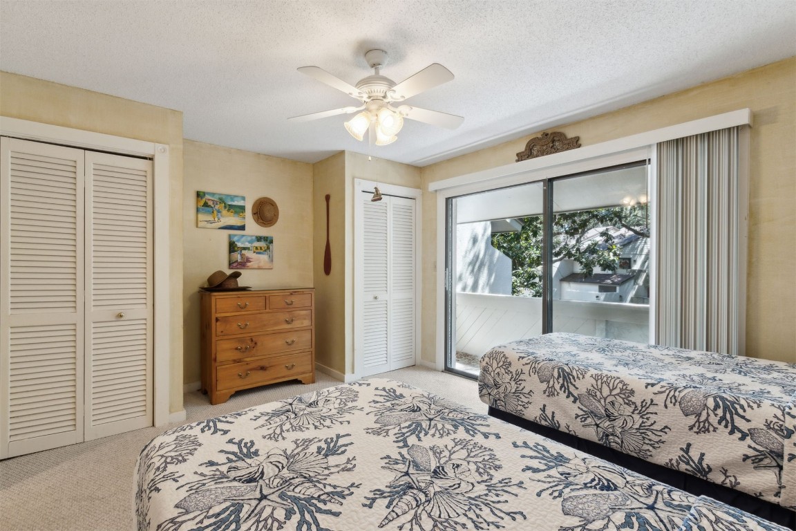3028 Sea Marsh Road, Unit 3028 Fernandina Beach, FL 32034 - Photo 19 of 39 a bedroom with a bed and a dresser
