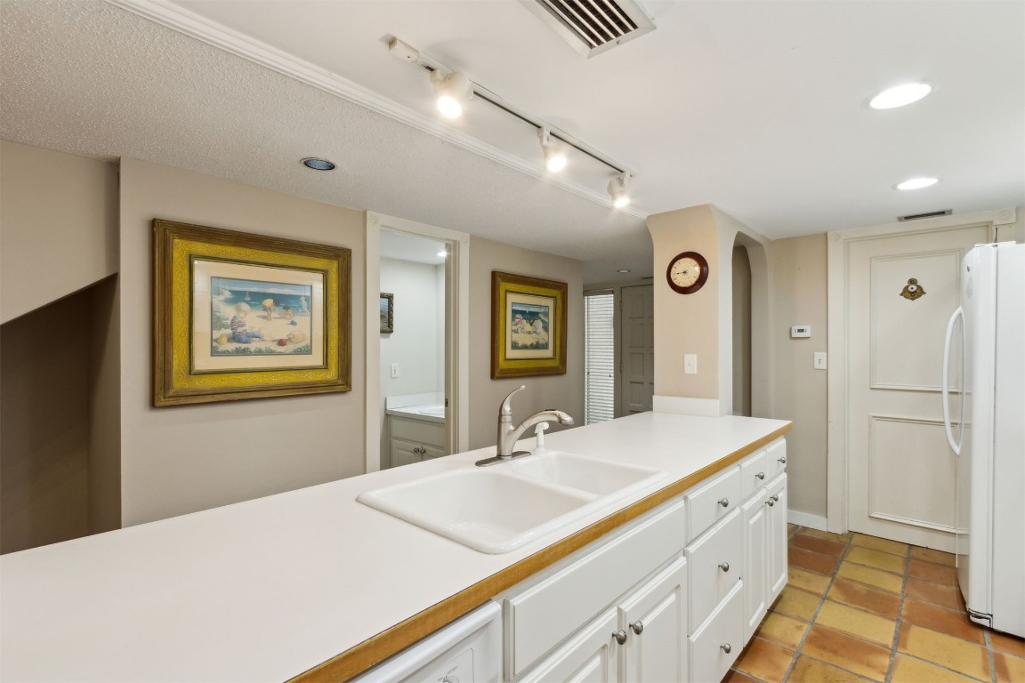 3028 Sea Marsh Road, Unit 3028 Fernandina Beach, FL 32034 - Photo 8 of 39 a spacious bathroom with a granite countertop sink a mirror and a shower