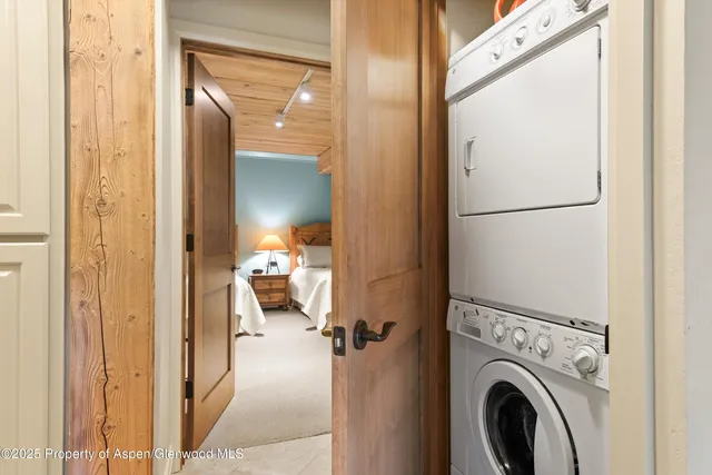a view of a hallway with washer and dryer