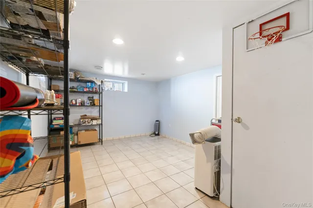 a kitchen with stainless steel appliances granite countertop a sink a stove a refrigerator and cabinets