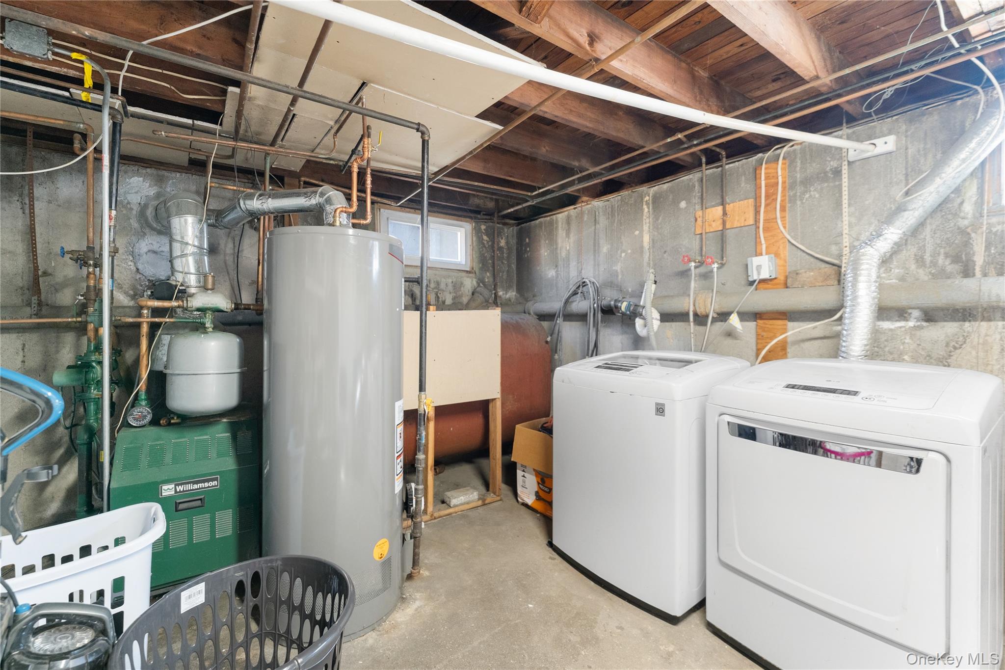 90 27th Street Copiague, NY 11726 - Photo 15 of 18 a utility room with dryer and washer