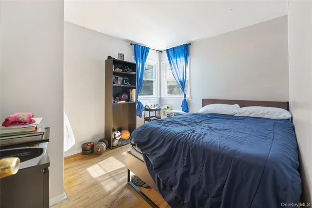 a bedroom with furniture and a window