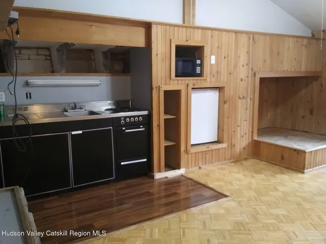 a kitchen with stainless steel appliances a stove and a refrigerator