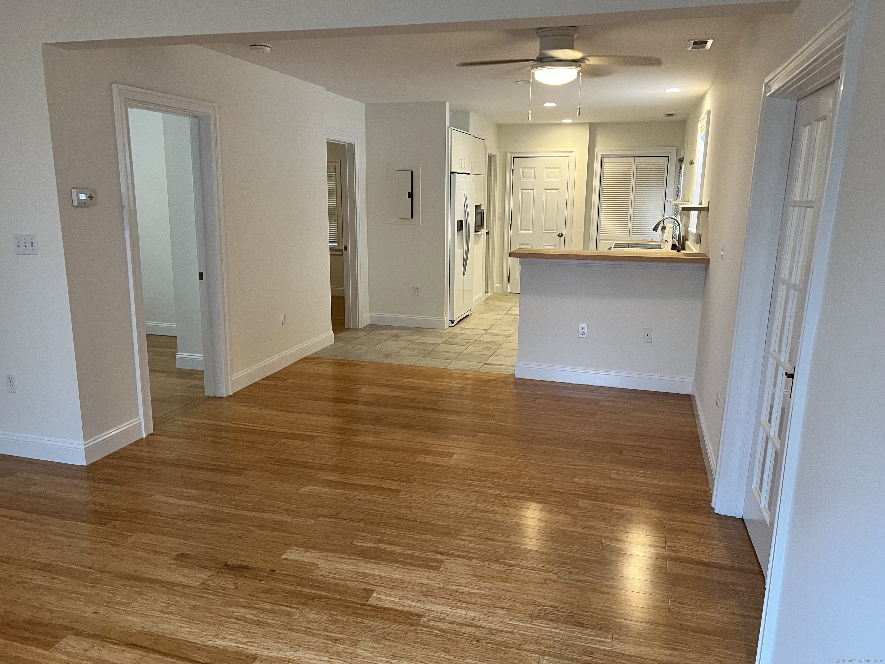 170 Shore Road Clinton, CT 06413 - Photo 12 of 20 a view of a kitchen cabinets and a wooden floor