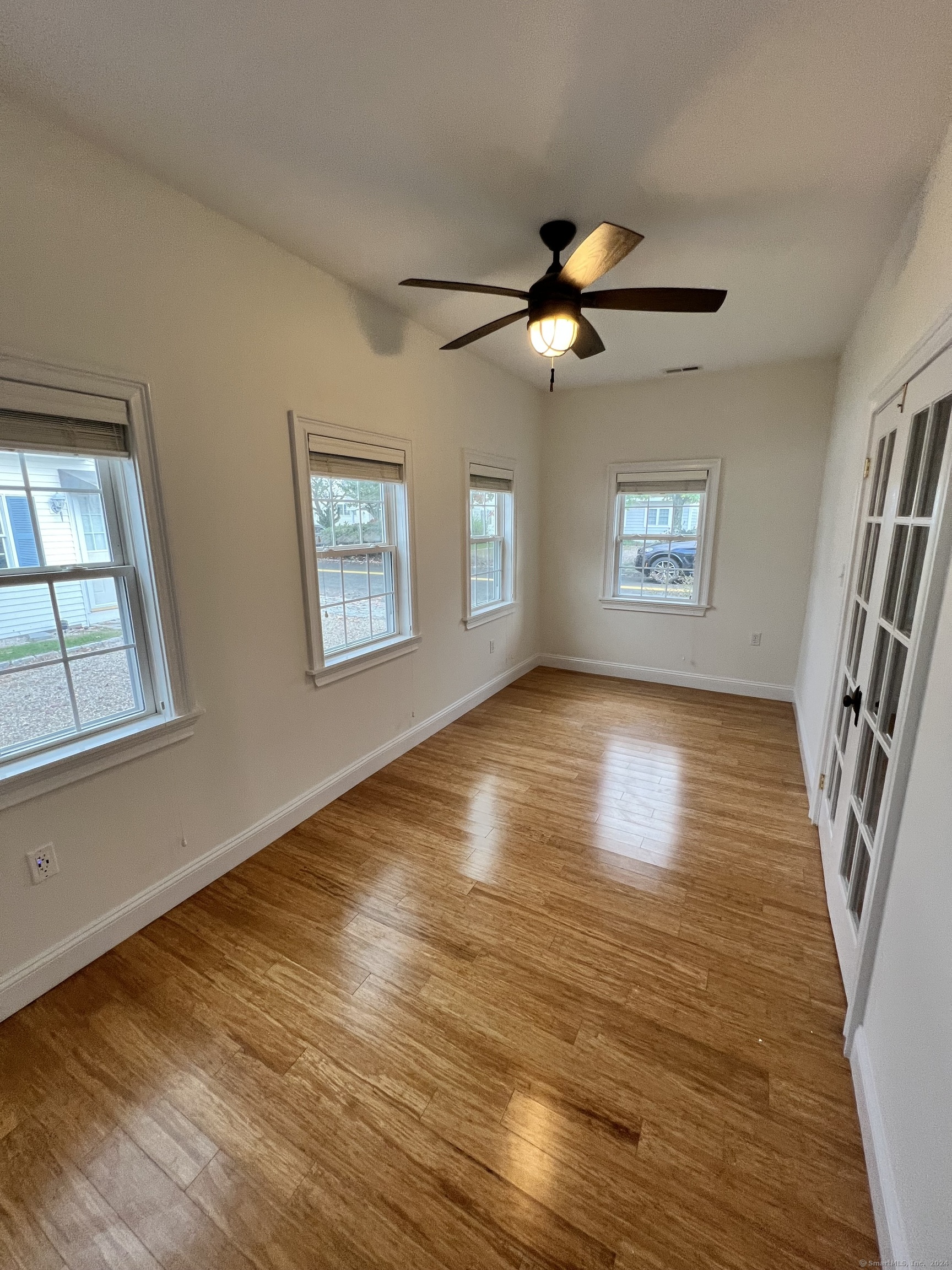 170 Shore Road Clinton, CT 06413 - Photo 15 of 20 wooden floor in an empty room with a window