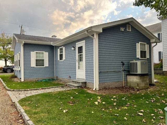 a view of a water with large trees