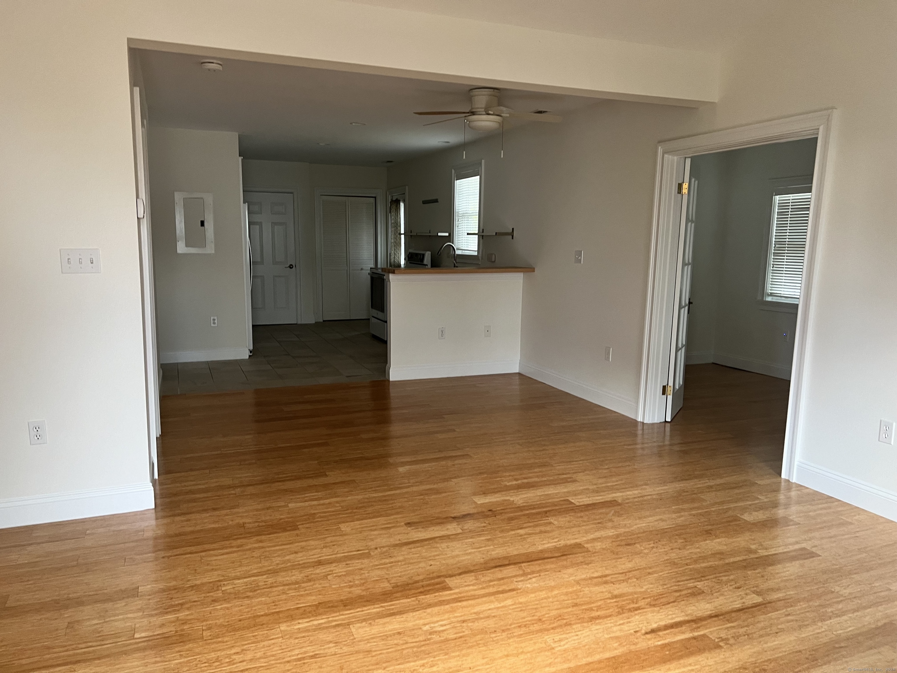 170 Shore Road Clinton, CT 06413 - Photo 6 of 20 a view of a kitchen with wooden floor and a sink