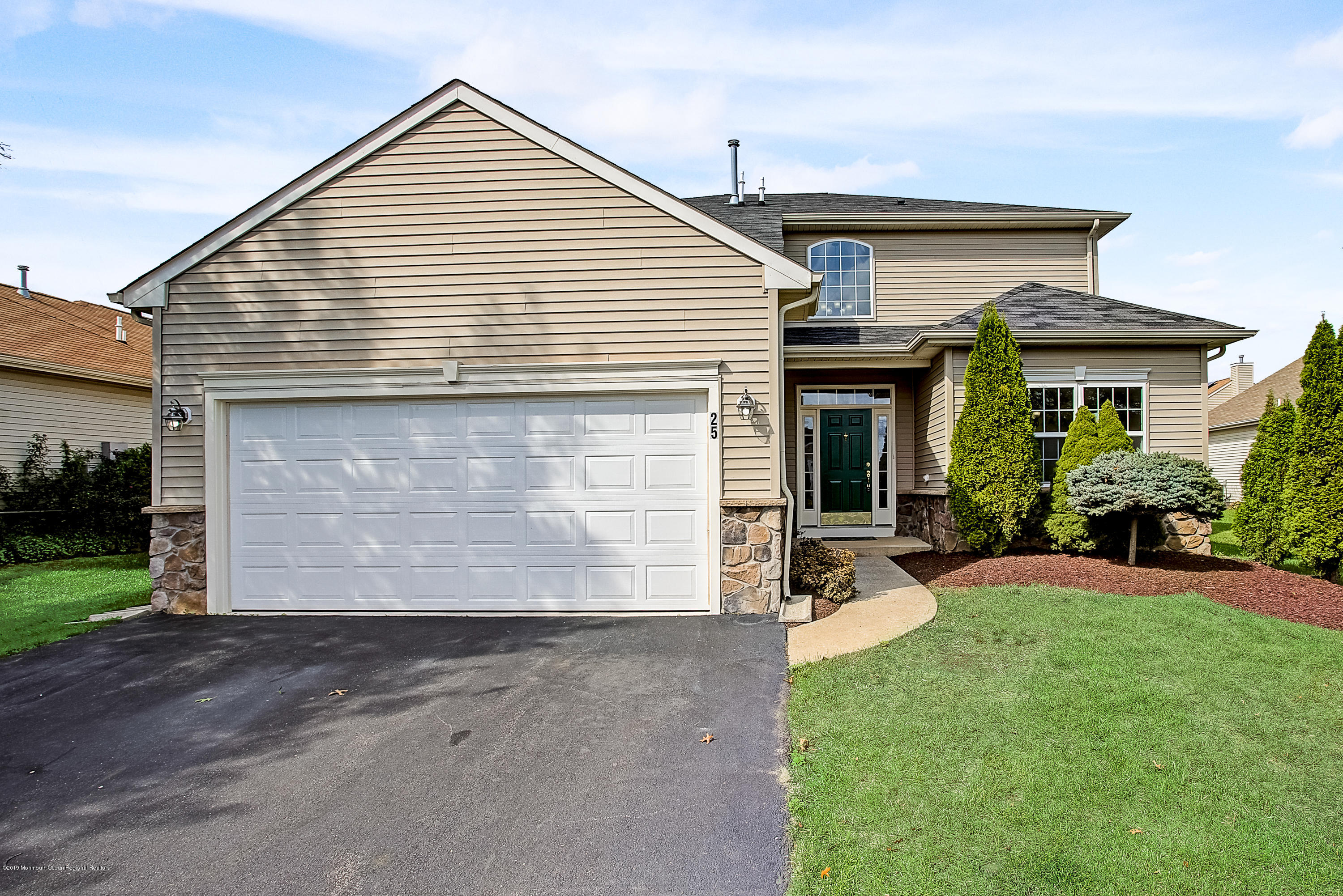 25 Torino Road Manchester Township, NJ 08759 - Photo 1 of 31 a front view of a house with garden