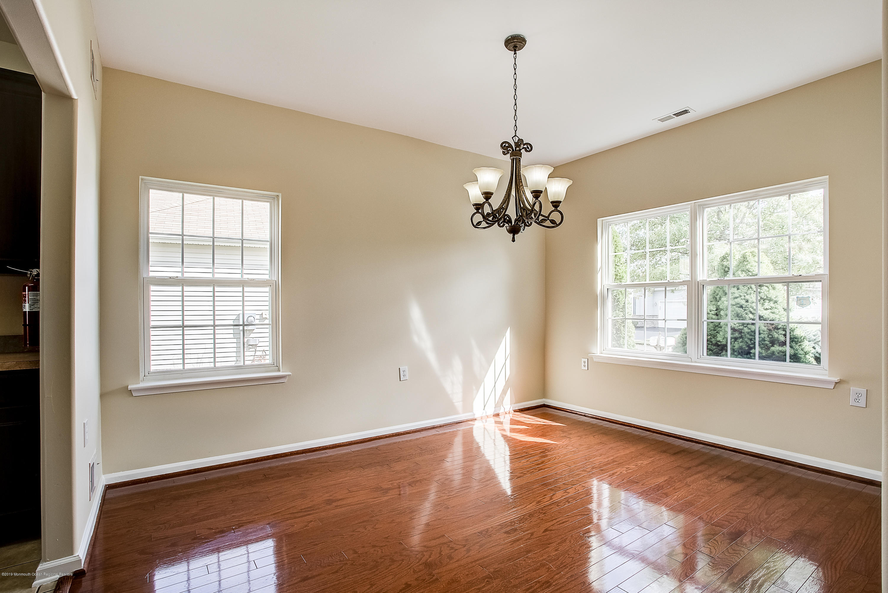 25 Torino Road Manchester Township, NJ 08759 - Photo 12 of 31 a view of a livingroom with a window and wooden floor