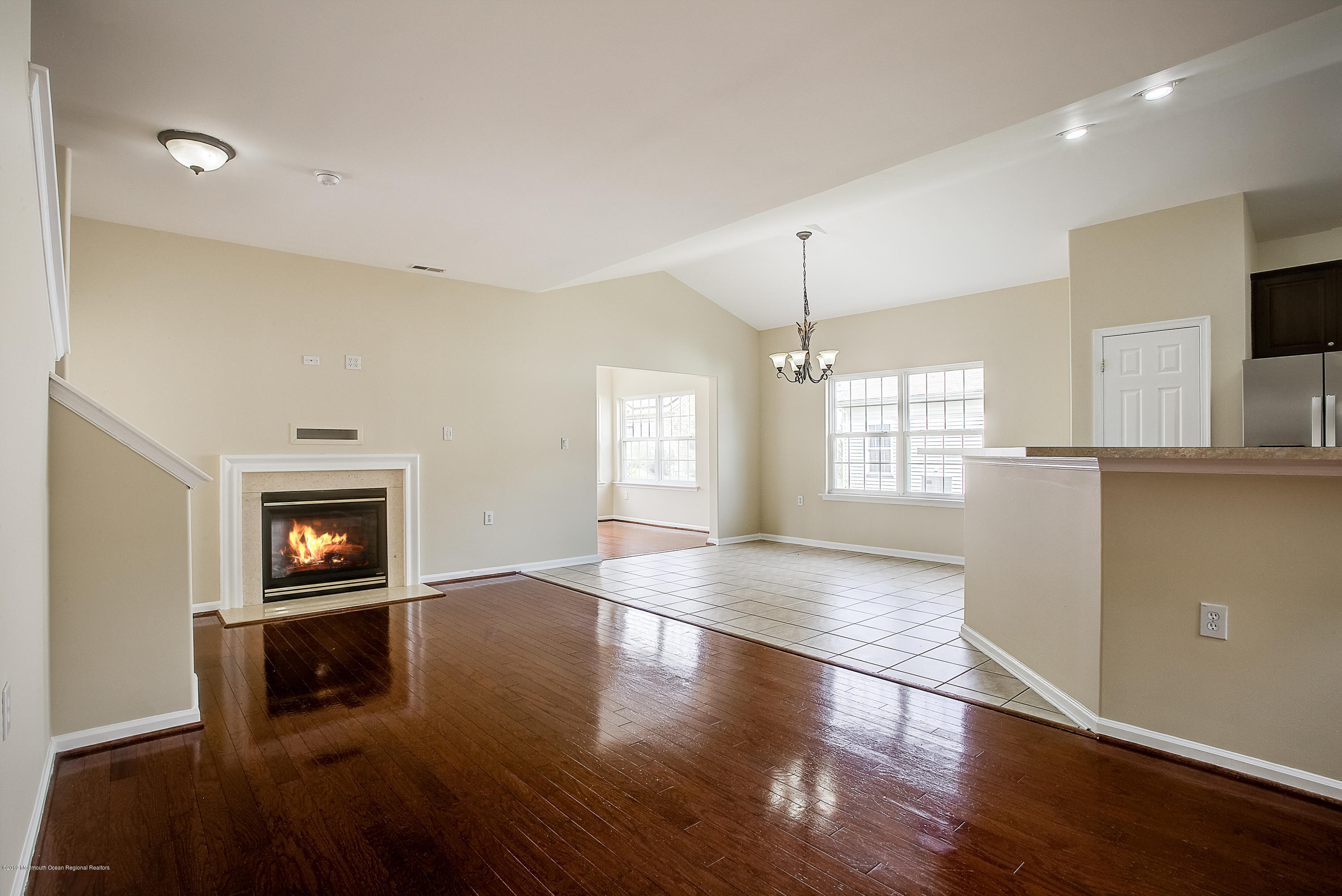 25 Torino Road Manchester Township, NJ 08759 - Photo 14 of 31 a view of an empty room with window and wooden floor