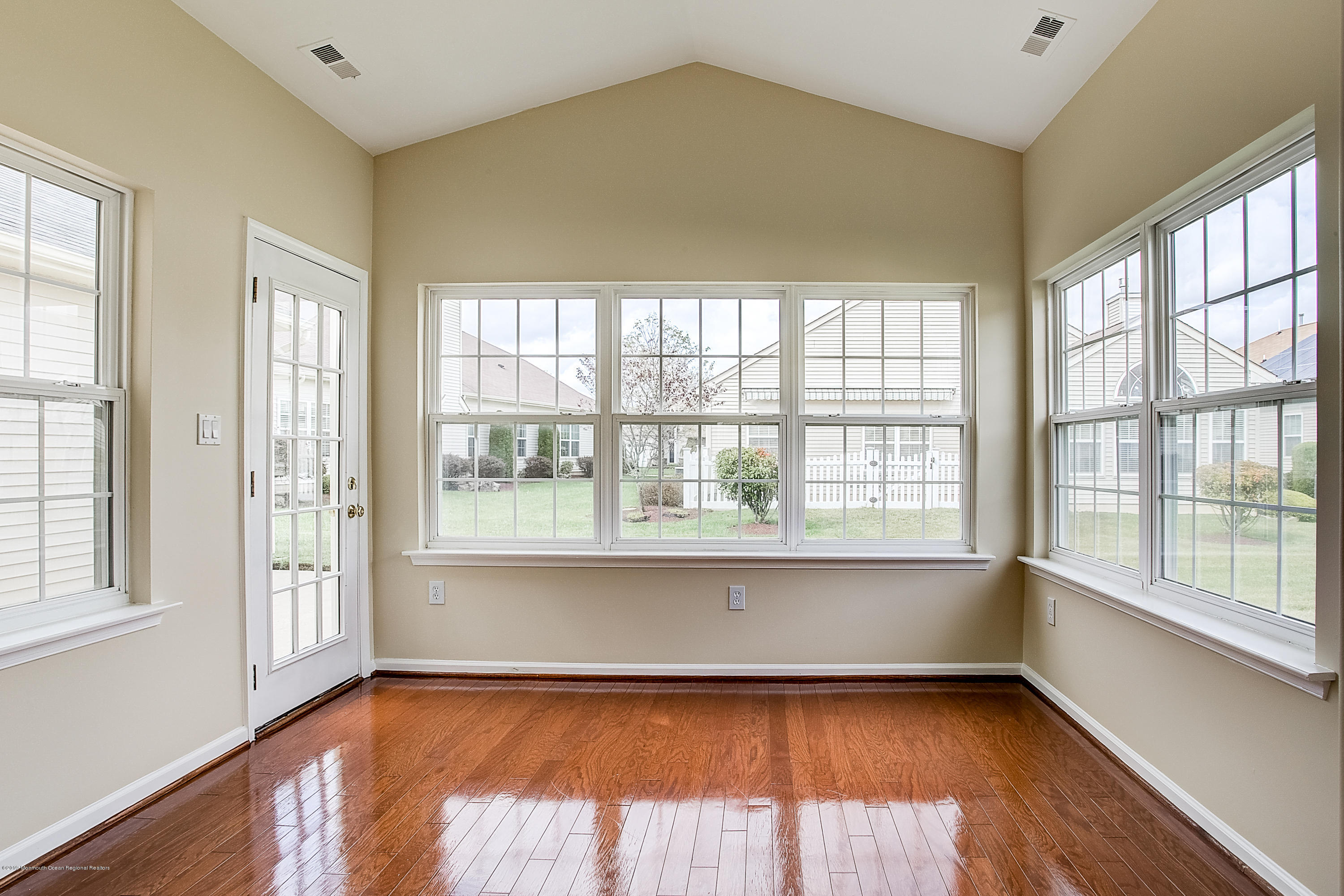 25 Torino Road Manchester Township, NJ 08759 - Photo 15 of 31 a view of an empty room with wooden floor and a window